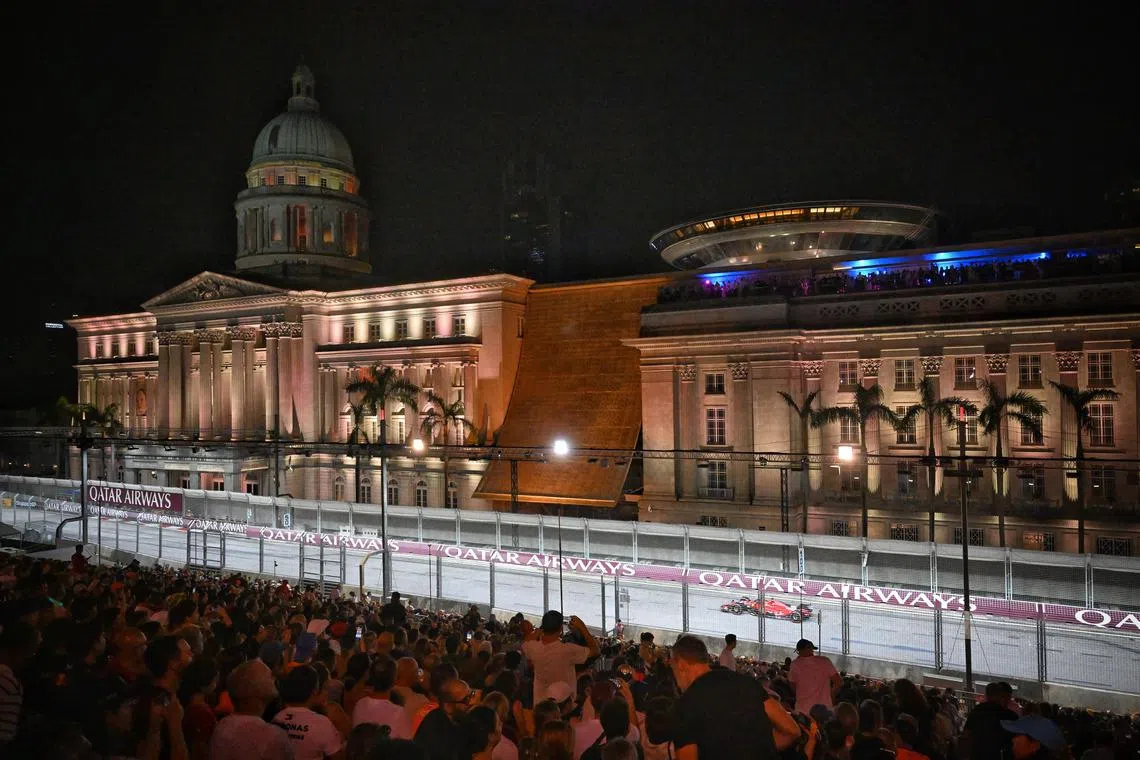 Ferrari’s Carlos Sainz driving past the Padang on the second night of the Formula 1 Singapore Airlines Singapore Grand Prix 2023.