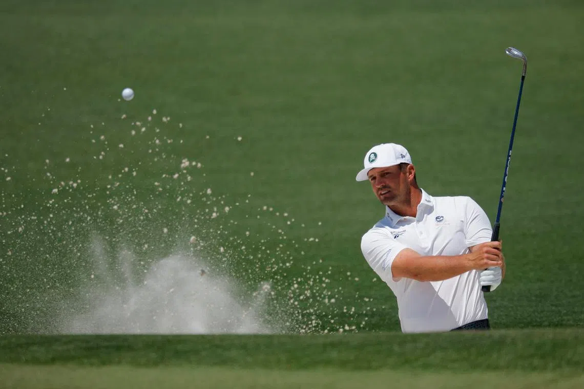 Golf - The Masters - Augusta National Golf Club, Augusta, Georgia, U.S. - April 10, 2026 Bryson DeChambeau of the U.S. plays out from the bunker on the 2nd hole during the second round REUTERS/Mike Blake