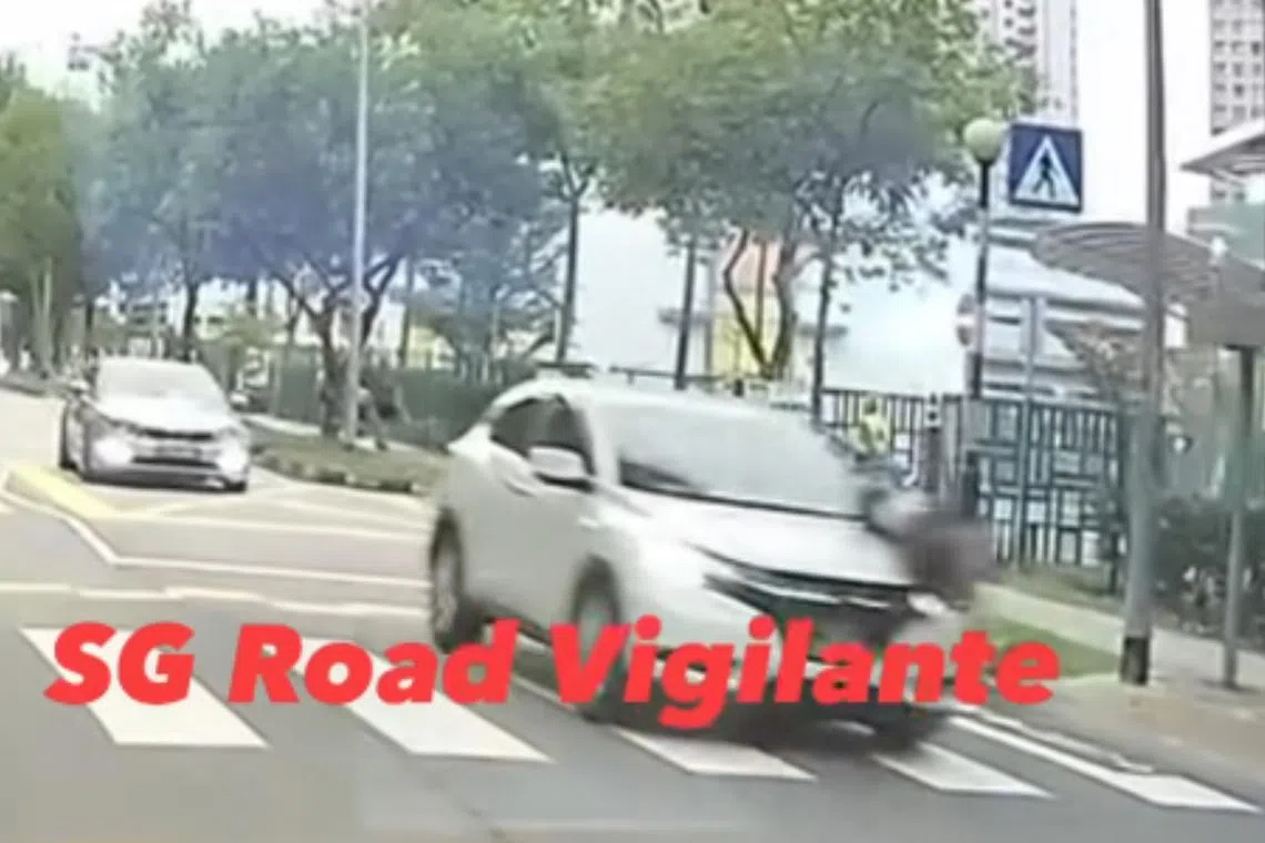 The girl is seen in video footage running across a zebra crossing after a road traffic warden waves her through.