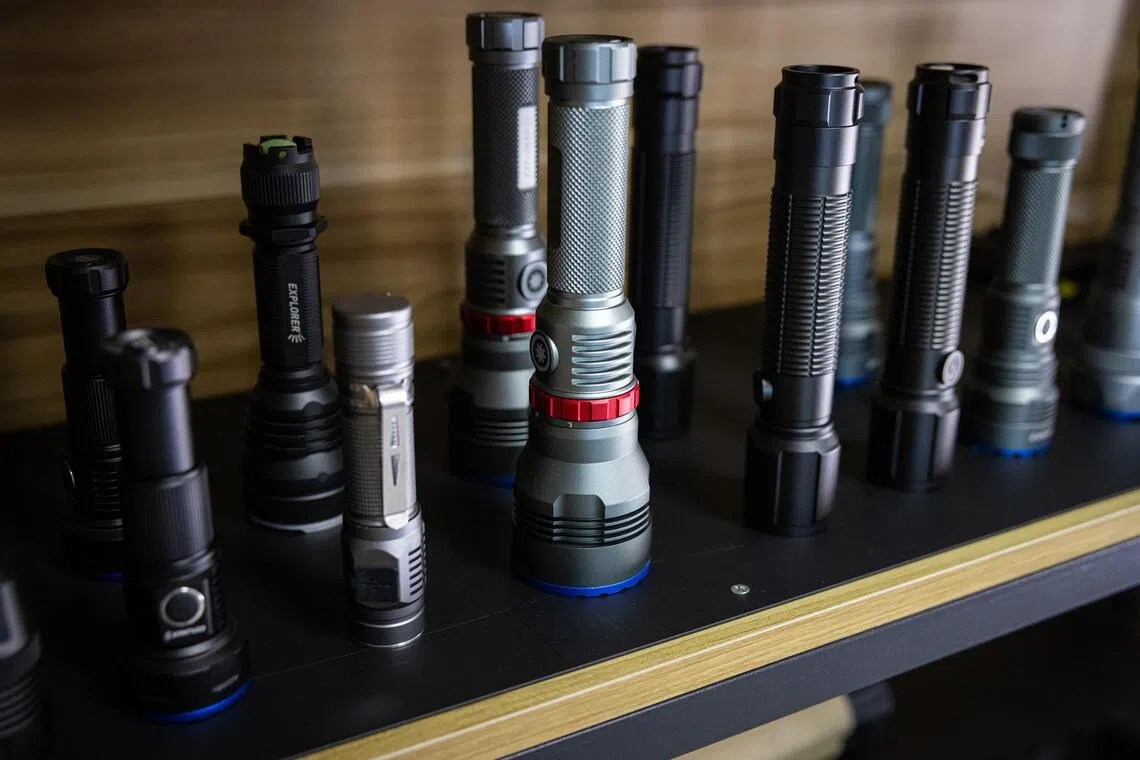 Flashlights and utility lights manufactured at factories in China and Thailand sit on display inside a corporate office at Ningbo Bright Electric Factory in Rayong, Thailand, on July 20.