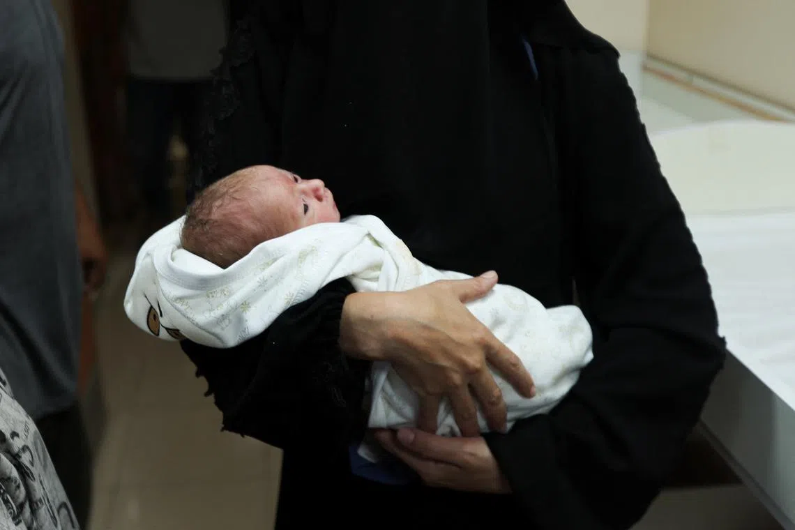 FILE PHOTO: Palestinian baby Malek Yassin, who was saved from the womb of his mother Ola Al-Kurd, who was killed in an Israeli strike, according to medics, amid the ongoing Israel-Hamas conflict, lies in an incubator at a hospital in central Gaza Strip July 20, 2024. REUTERS/Ramadan Abed/File Photo