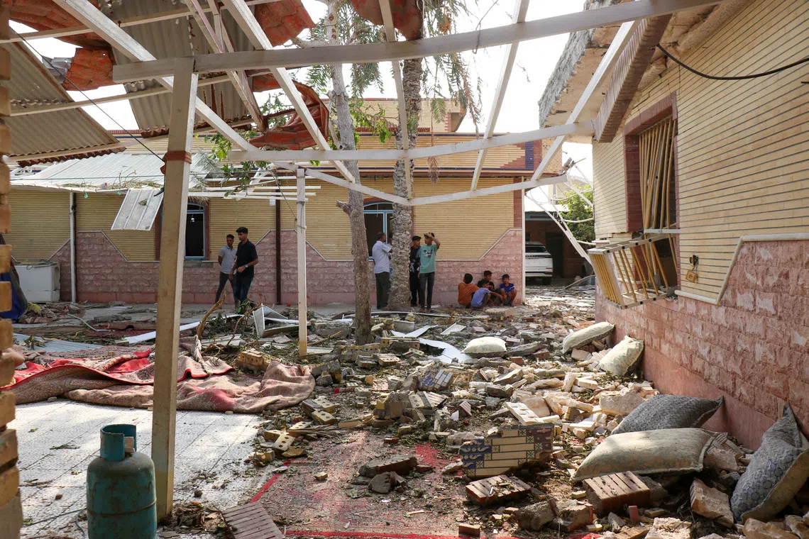 Rubble lying around damaged houses on Sept 2 following an attack near a wedding gathering in Kuhistik, Sirik, Iran.