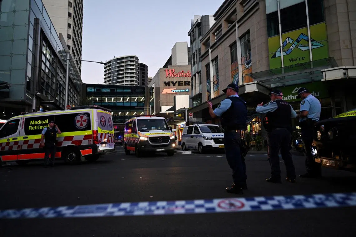 FILE PHOTO: Emergency service workers are seen near Bondi Junction after multiple people were stabbed inside the Westfield Bondi Junction shopping centre in Sydney, April 13, 2024. AAP Image/Steven Saphore via REUTERS/File Photo
