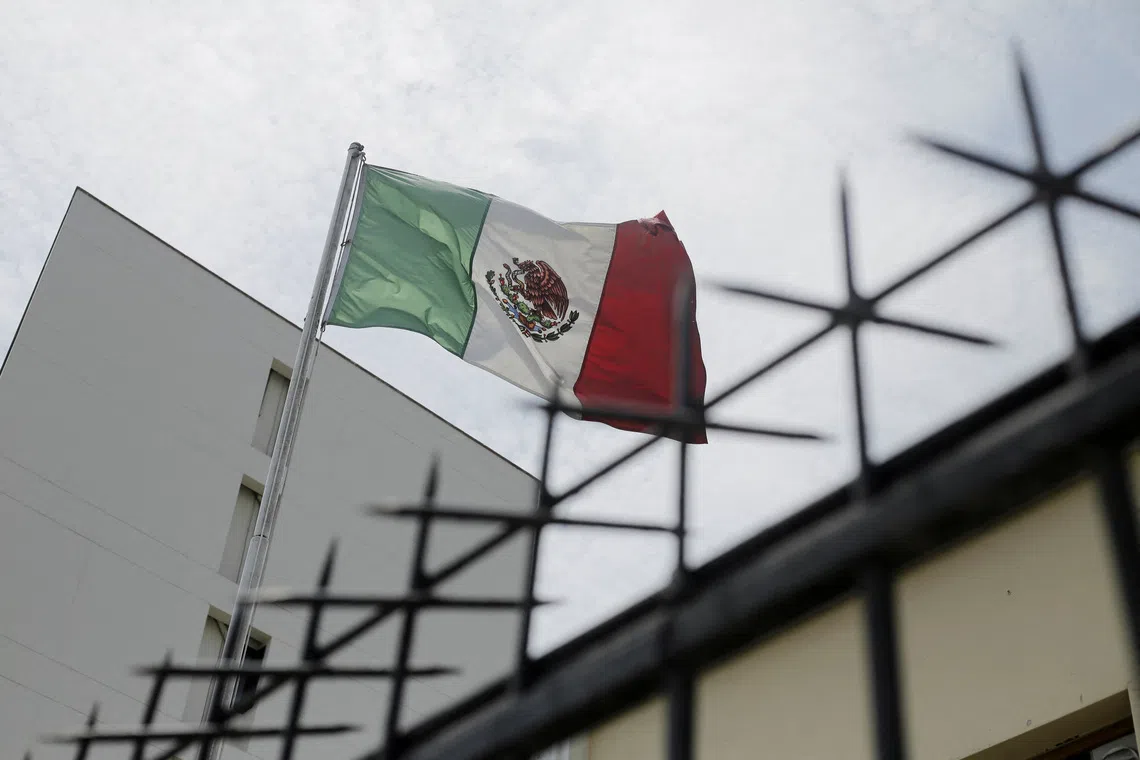 FILE PHOTO: A Mexican flag flutters at Mexico’s embassy in Lima in Peru, November 5, 2025. REUTERS/Gerardo Marin/ File Photo