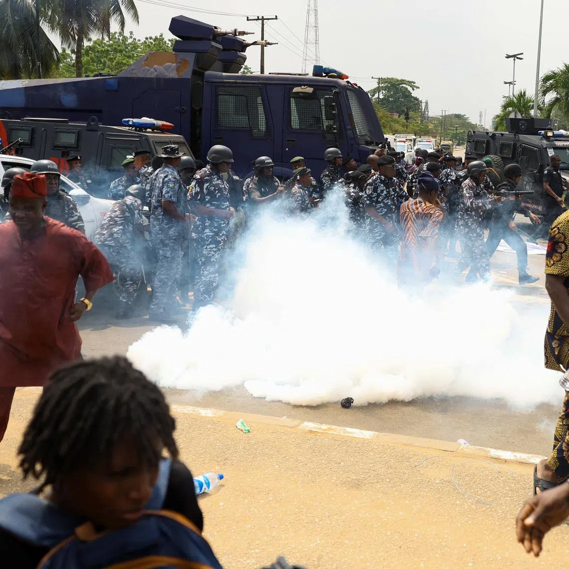 Members of the Nigerian police lob teargas canisters to disperse demonstrators during a protest by residents of Makoko riverine community over the demolition of their stilt houses in Lagos, Nigeria, January 28, 2026. REUTERS/Sodiq Adelakun