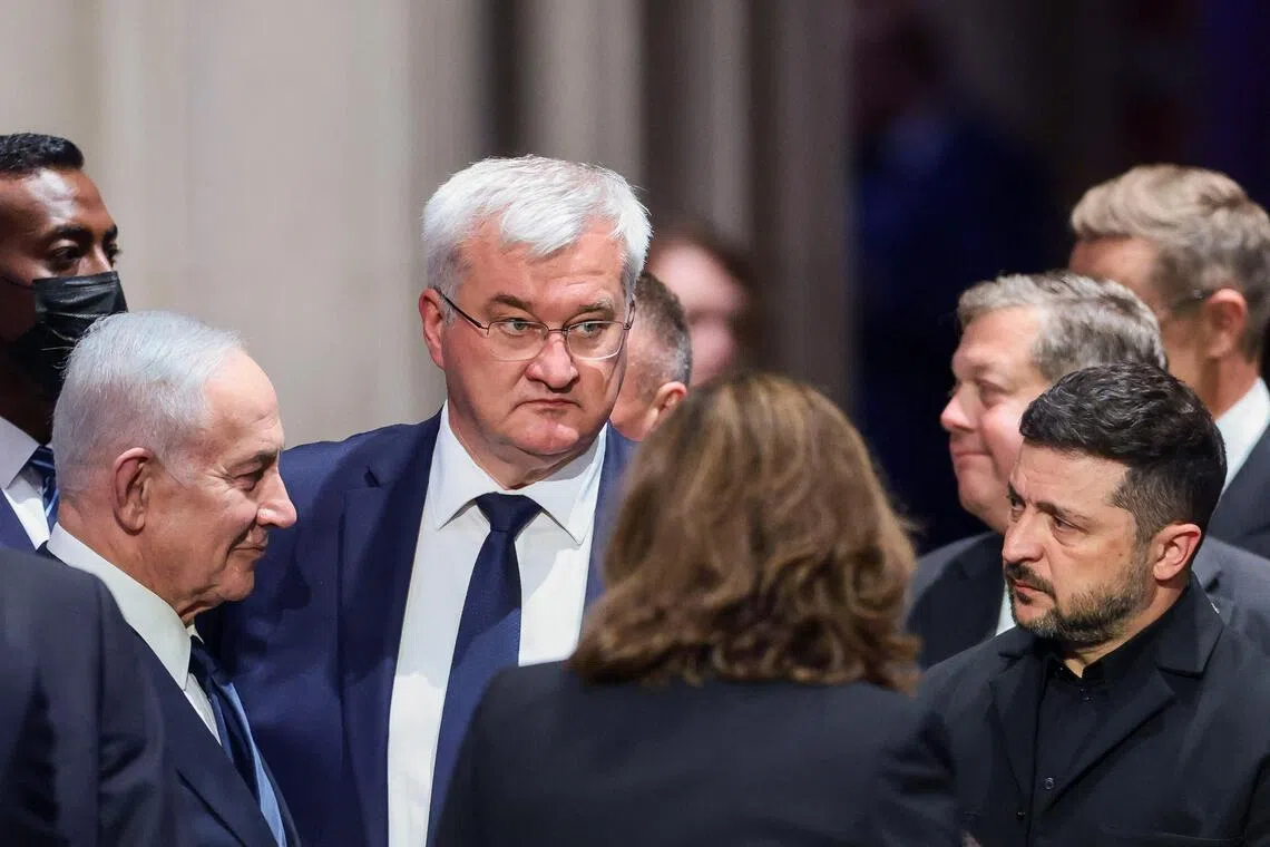 (From left) Israeli Prime Minister Benjamin Netanyahu, Ukrainian Foreign Minister Andrii Sybiha, Ukrainian President Volodymyr Zelensky and other officials attending the funeral service for late US Senator Lindsey Graham in Washington, on July 28.
