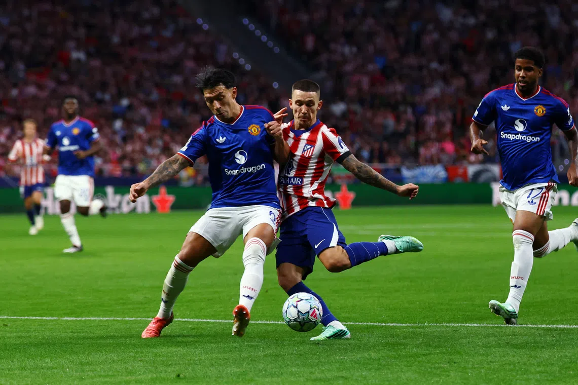 Soccer Football - UEFA Champions League - Atletico Madrid v Manchester United - Riyadh Air Metropolitano, Madrid, Spain - October 13, 2026 Manchester United's Lisandro Martinez in action with Atletico Madrid's Alejandro Grimaldo REUTERS/Susana Vera