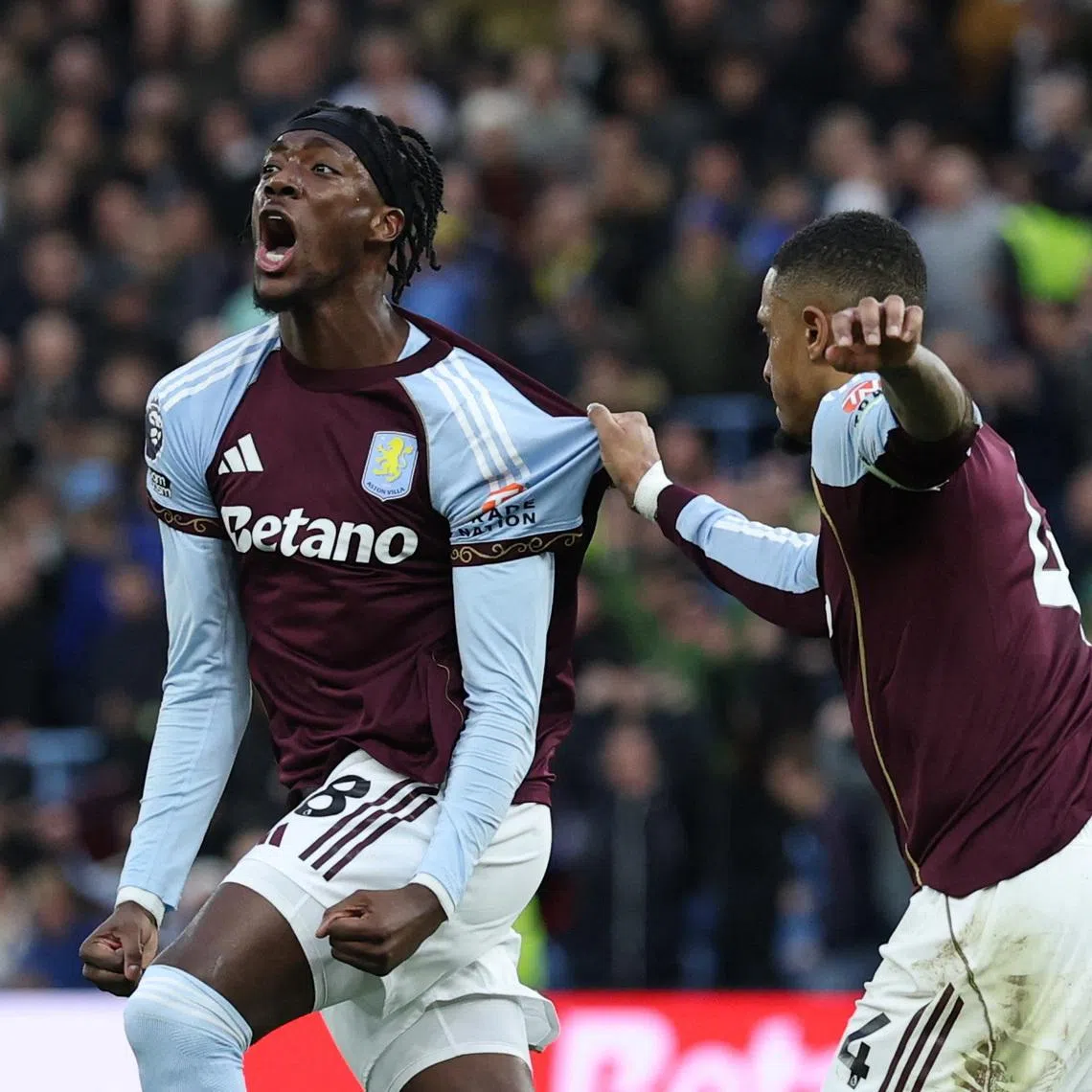 Soccer Football - Premier League - Aston Villa v Leeds United - Villa Park, Birmingham, Britain - February 21, 2026 Aston Villa's Tammy Abraham celebrates scoring their first goal with Ezri Konsa Action Images via Reuters/Paul Childs