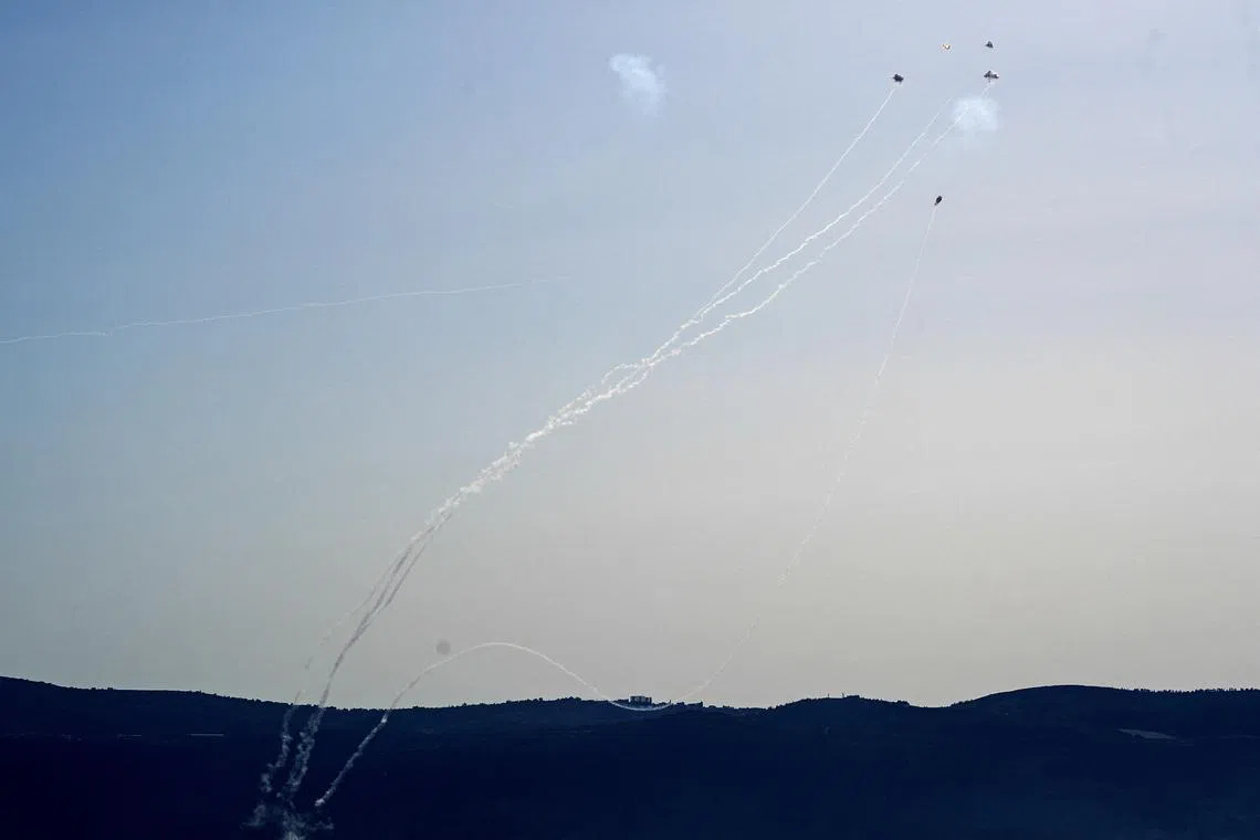 FILE PHOTO: Rockets launched from Lebanon to Israel over the border are intercepted, amid the ongoing cross-border hostilities between Hezbollah and Israeli forces, in Israel, near the border with Lebanon, July 3, 2024. REUTERS/Ayal Margolin/File Photo