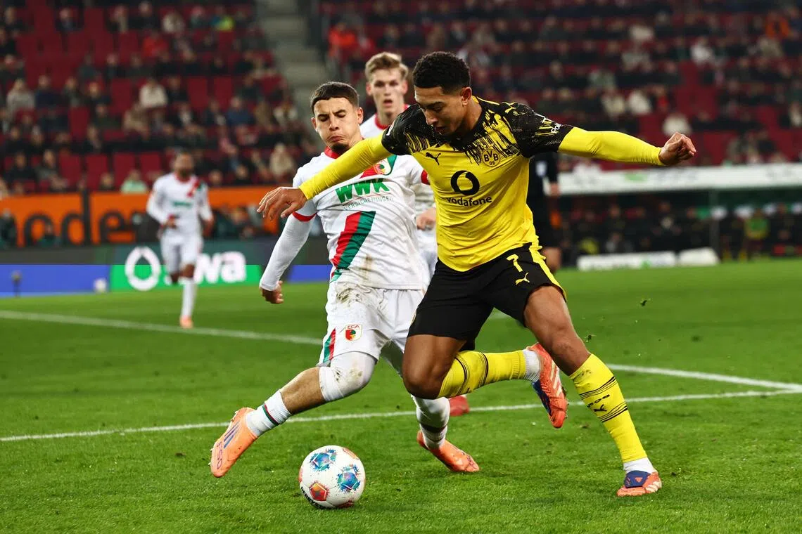 Jobe Bellingham (right) of Borussia Dortmund in action during the 1-0 Bundesliga away win over Augsburg on Oct 31, 2025 at the Augsburg Arena. 