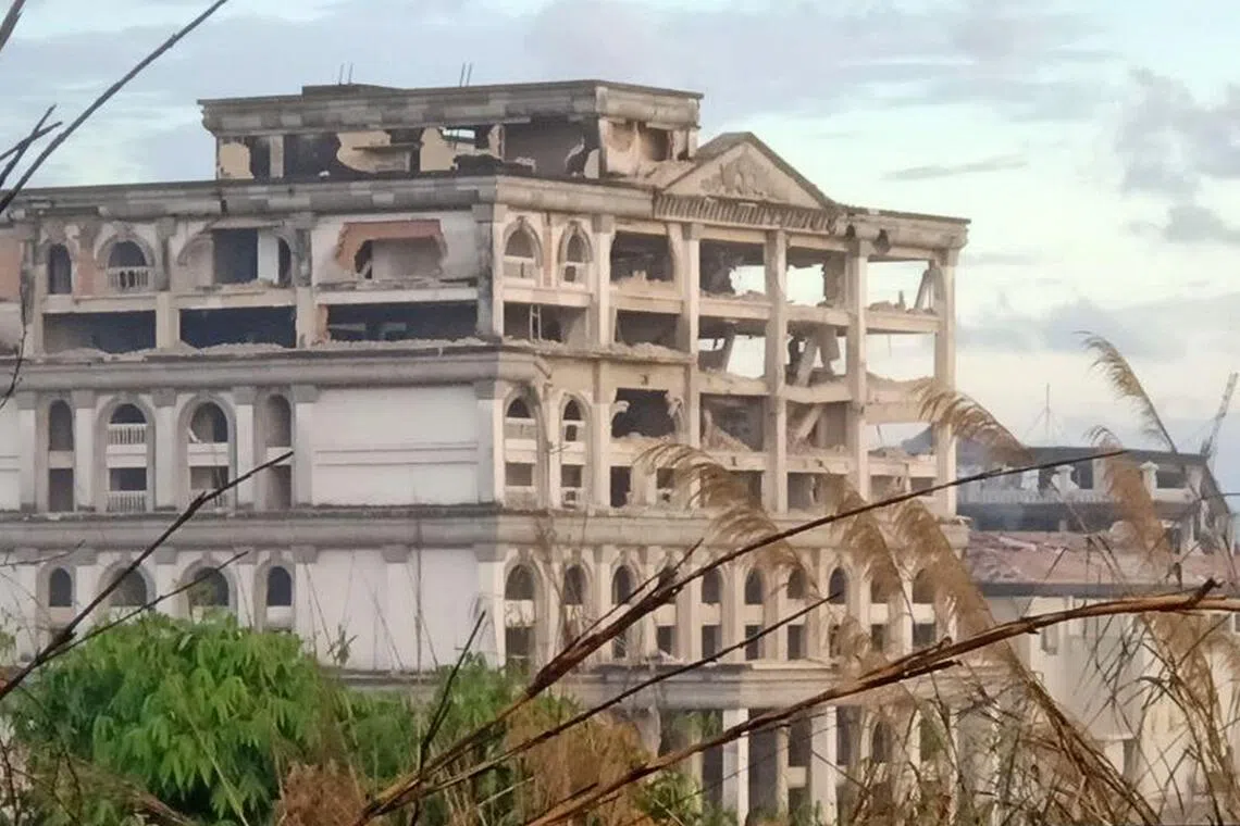 The photo, taken on Dec 13, 2025, shows damage to a casino caused by Thai strikes in Pursat Province, amid clashes along the Cambodia-Thailand border.