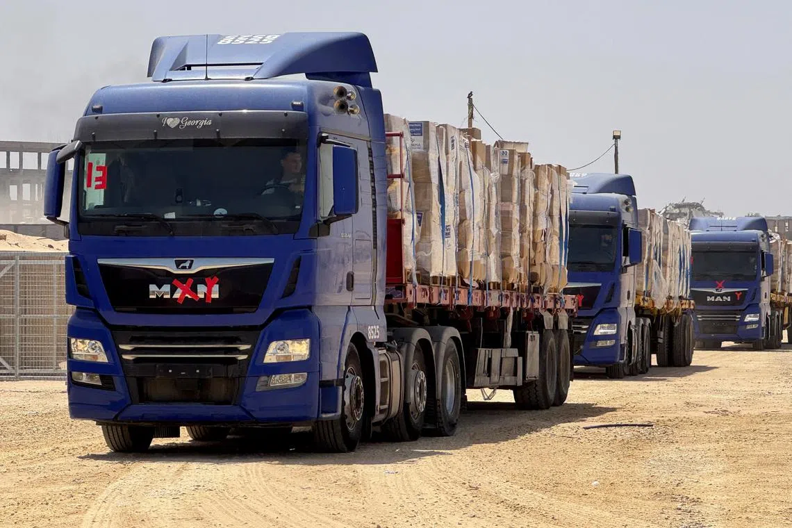 FILE PHOTO: Trucks transport aid as Gaza Humanitarian Foundation said it has commenced operations to begin distribution of aid, in Rafah, in the southern Gaza Strip, May 26, 2025. Gaza Humanitarian Foundation/Handout via REUTERS/File Photo