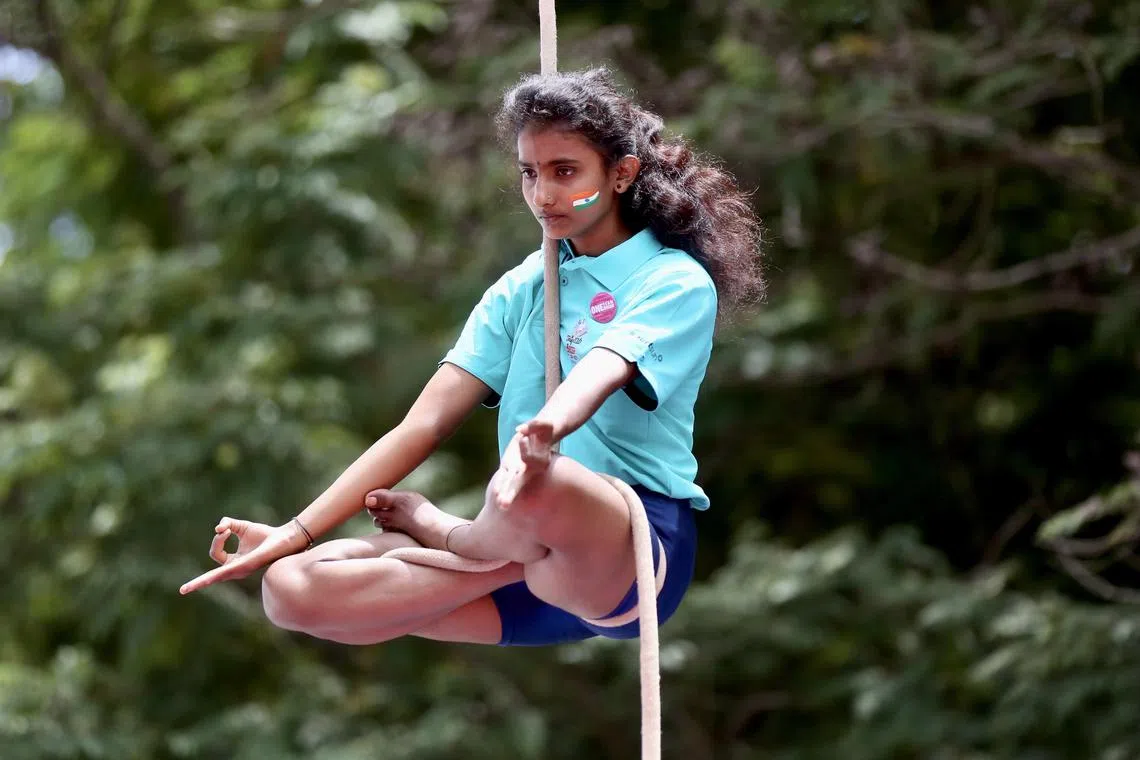 Students and sport enthusiasts performing yoga as they mark National Sports Day in Bangalore, India on August  29, 2023. The National Sports Day in India is celebrated on 29 August every year and celebrated to commemorate the birth anniversary of hockey legend Major Dhyan Chand Singh. 