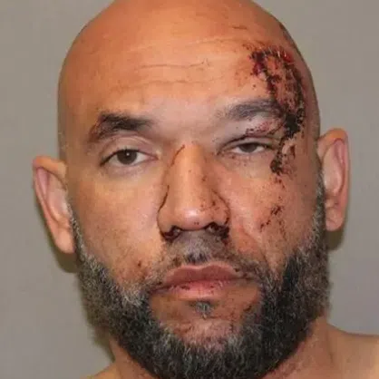 Anthony William Newhuis, 41, was arrested on charges of assault and criminal mischief.
