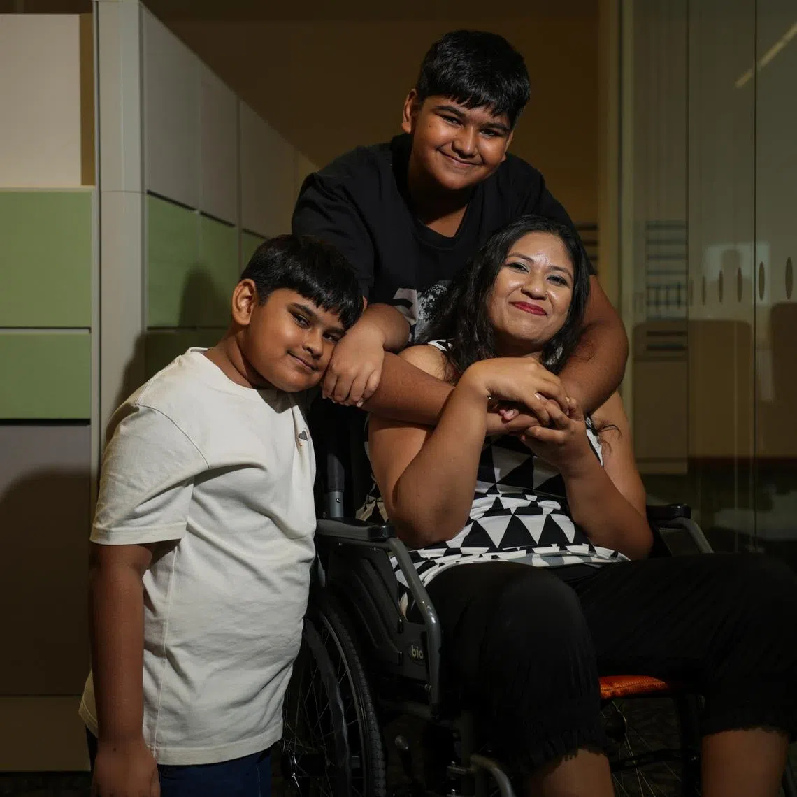 Ms Poonam Choudhary, (right) 43, a home baker; and her sons (from left): Aayansh Choudhary, 11; and Aarav Choudhary, 13.