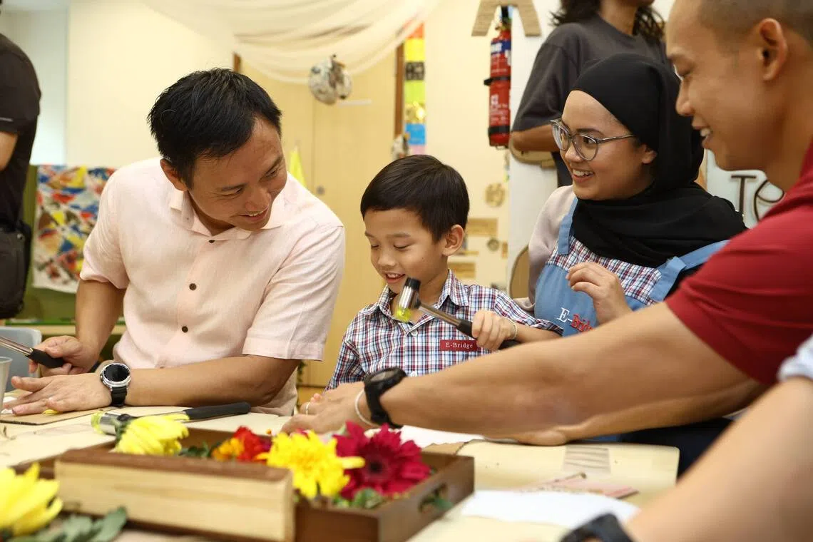 Senior Minister of State for Social and Family Development Goh Pei Ming interacting with educators, parents and pre-school students at E-Bridge Pre-School @ Sumang Lane on Aug 28.