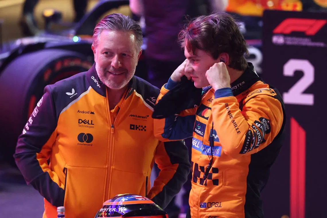 Formula One F1 - Qatar Grand Prix - Lusail International Circuit, Lusail, Qatar - November 29, 2025 McLaren's Oscar Piastri celebrates with McLaren chief executive Zak Brown after qualifying in pole position REUTERS/Jakub Porzycki/File Photo