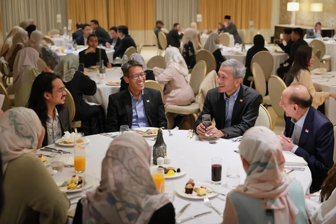 Foreign Minister Vivian Balakrishnan (second from right), Workers’ Party MP Gerald Giam (second from left) and Singapore’s Non-Resident Ambassador to Jordan Shamsher Zaman (right) joining Singaporean students in Amman for iftar on March 17.
