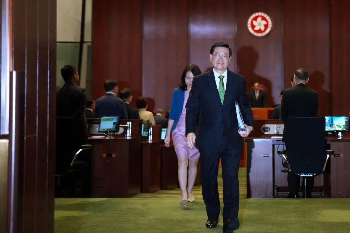 John Lee, Hong Kong's chief executive, leaves after delivering his policy address at the Legislative Council in Hong Kong, China, on Wednesday, Sept. 17, 2025. Lee said the city will accelerate the development of a cross-border tech hub with China as the Asian financial center searches for new growth drivers. Photographer: Lam Yik/Bloomberg
