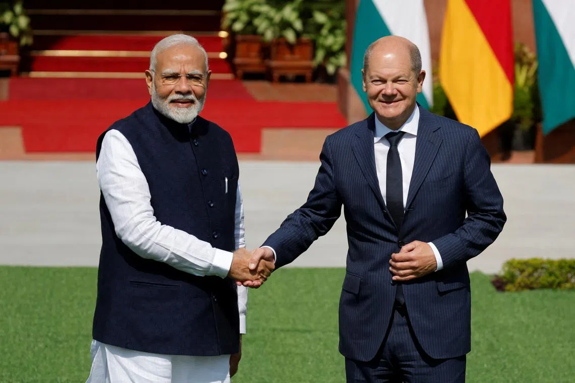 German Chancellor Olaf Scholz shakes hands with India's Prime Minister Narendra Modi before their meeting at Hyderabad House in New Delhi, India October 25, 2024. REUTERS/Adnan Abidi