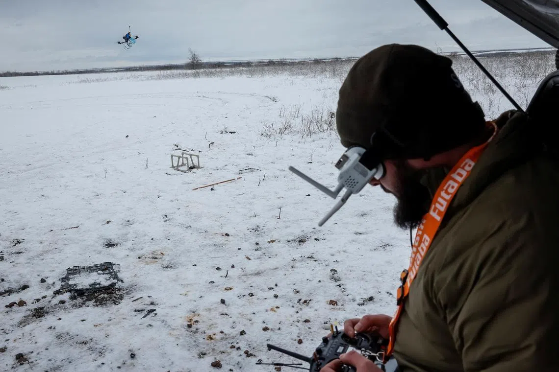 A Ukrainian serviceman practices with a first-person view (FPV) drone, amid Russia's invasion of Ukraine, at an undisclosed location in Ukraine's Donetsk region.