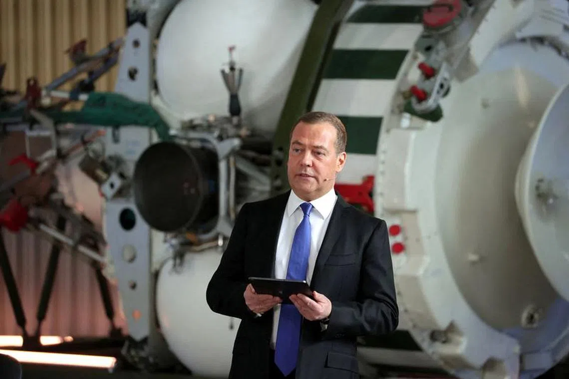 FILE PHOTO: Deputy head of Russia's Security Council Dmitry Medvedev attends a meeting with officials and employees of the military industrial corporation \"Scientific and Production Machine Building Association\" in the town of Reutov in the Moscow region, Russia, April 25, 2023. Sputnik/Yekaterina Shtukina/Pool via REUTERS /File Photo