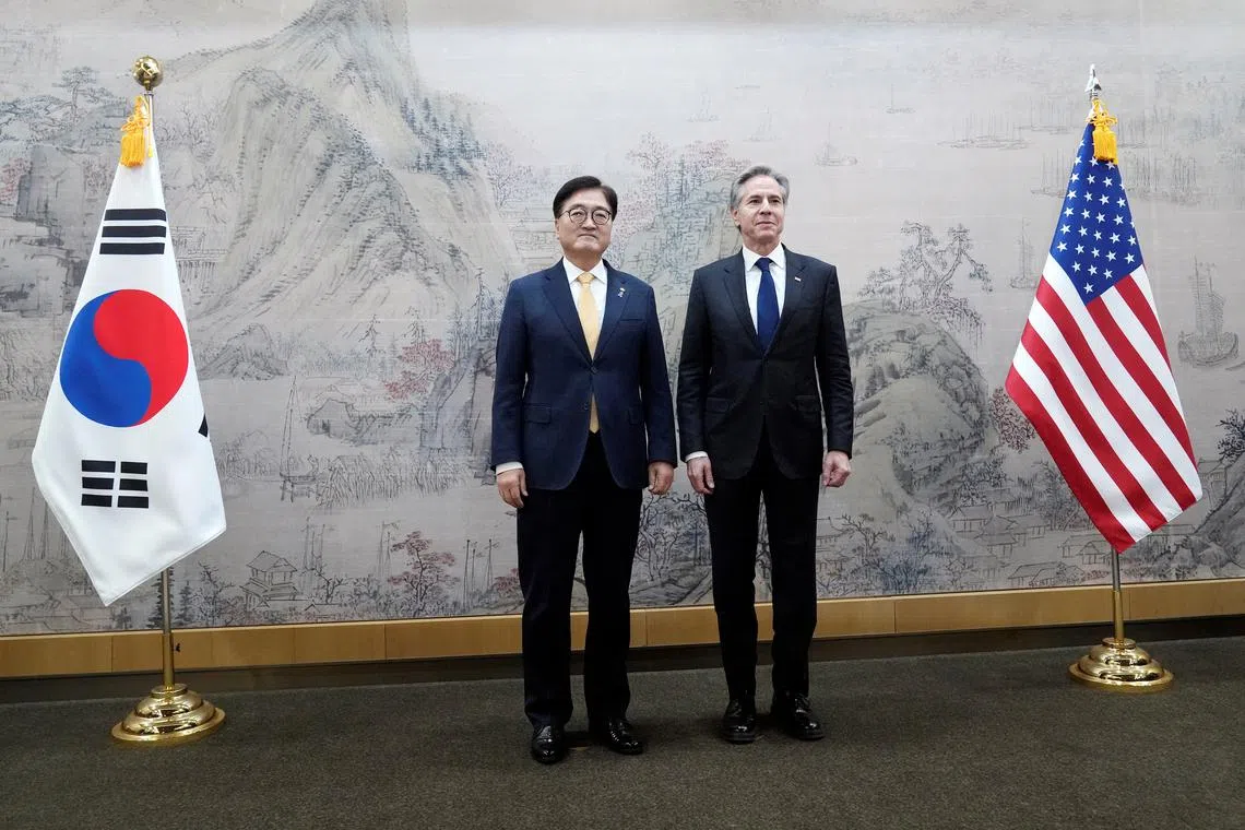 U.S. Secretary of State Antony Blinken, right, and South Korea's National Assembly Speaker Woo Won Shik, left, pose for photographers prior to a meeting at the National Assembly in Seoul, South Korea, Monday, Jan. 6, 2025.     Lee Jin-man/Pool via REUTERS