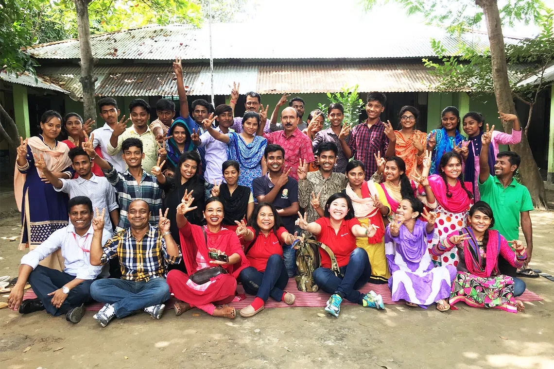In 2017, Ms Kelly Kwong (front row, third from right) volunteered in India, Bangladesh and the Philippines, where she supported youth development programmes as part of a six-month sabbatical fully backed by her employer.