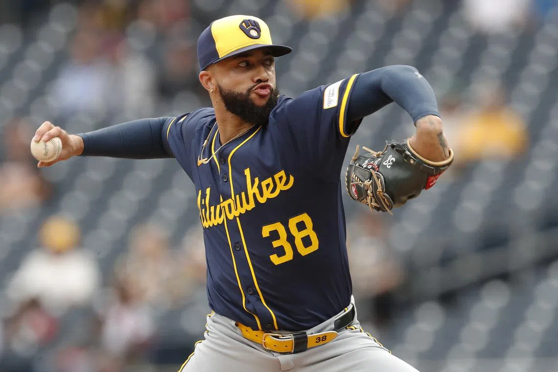 FILE PHOTO: Sep 26, 2024; Pittsburgh, Pennsylvania, USA;  Milwaukee Brewers relief pitcher Devin Williams (38) pitches against the Pittsburgh Pirates during the ninth inning at PNC Park. The Brewers won 5-2. Mandatory Credit: Charles LeClaire-Imagn Images/File Photo