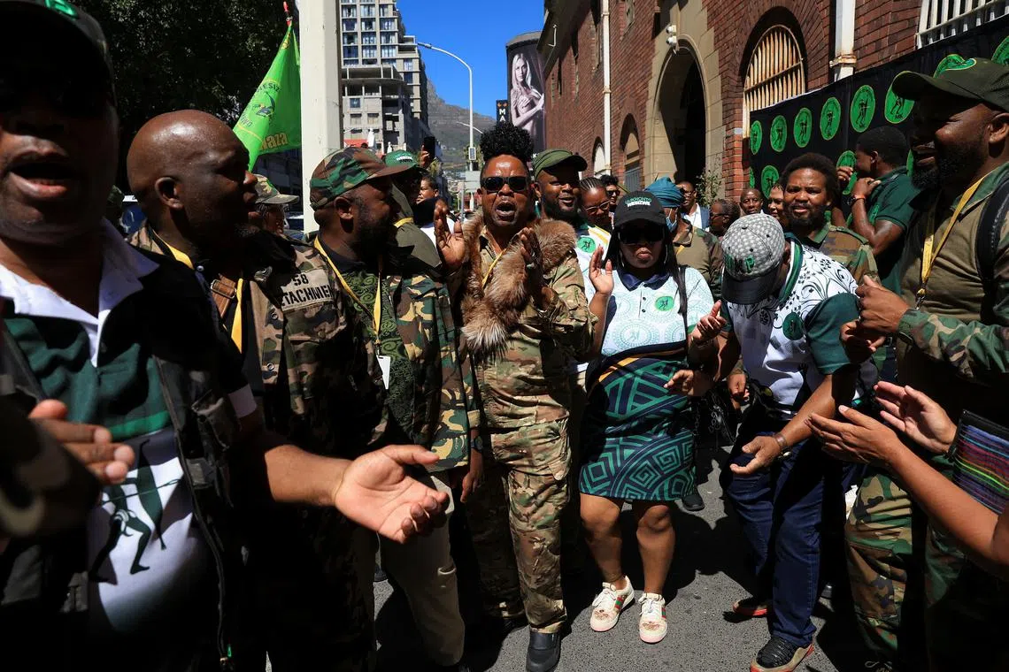 Former South African president Jacob Zuma's uMkhonto we Sizwe (MK) party members gather in front of Cape Town Central police station where the MK party opened a treason case against AfriForum - an Afrikaner-led group, in Cape Town, South Africa, February 10, 2025. REUTERS/Esa Alexander