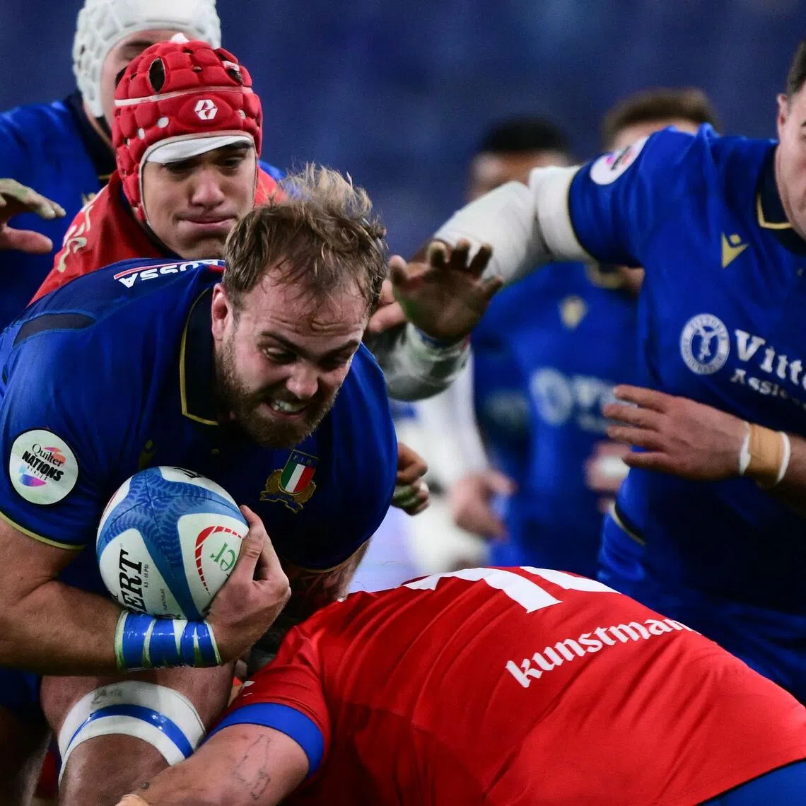 Italy lock Niccolo Cannone is tackled during the Autumn Nations Series rugby international test against Chile at Stadio Luigi Ferraris in Genoa, on Nov 22, 2025.