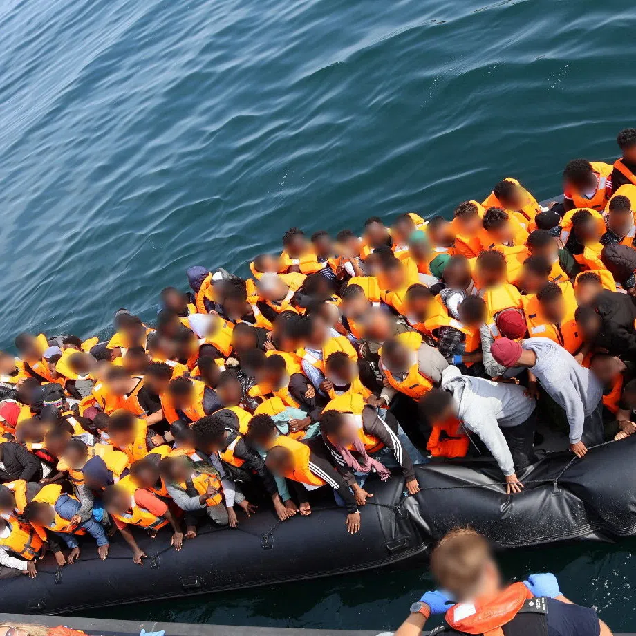 People on a boat used by Chan Mathok Atak, 19,  to transport 165 migrants from France to Britain, in this handout picture taken during the crossing of the English Channel on July 23, 2026, as Atak has been sentenced to 27 months in prison at Canterbury Crown Court. National Crime Agency/Handout via REUTERS