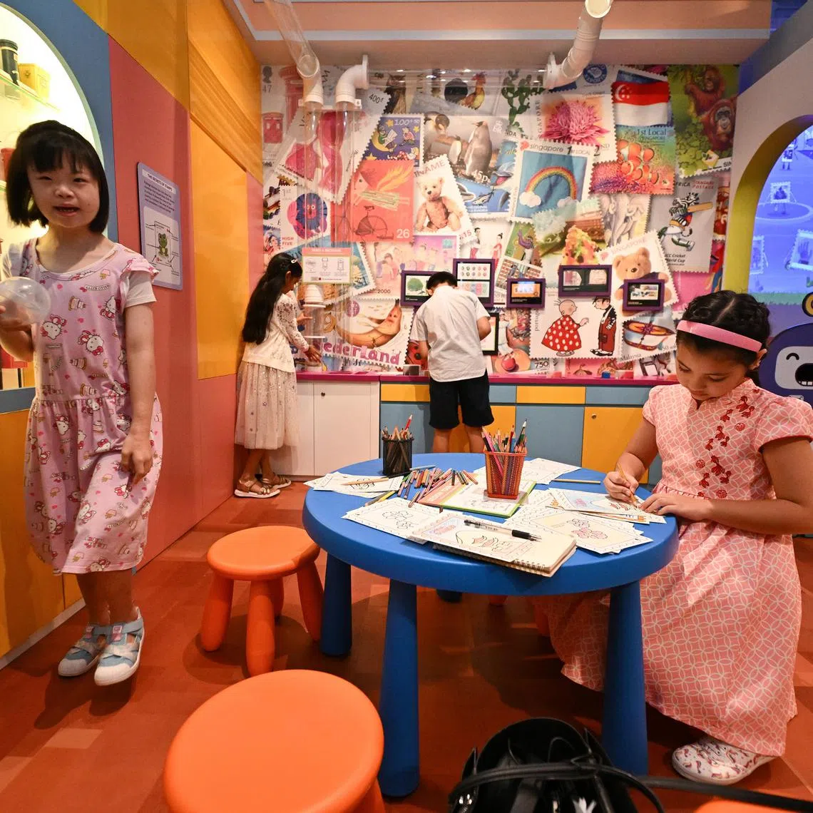 Children playing inside My Neighbourhood gallery of Children's Museum Singapore.