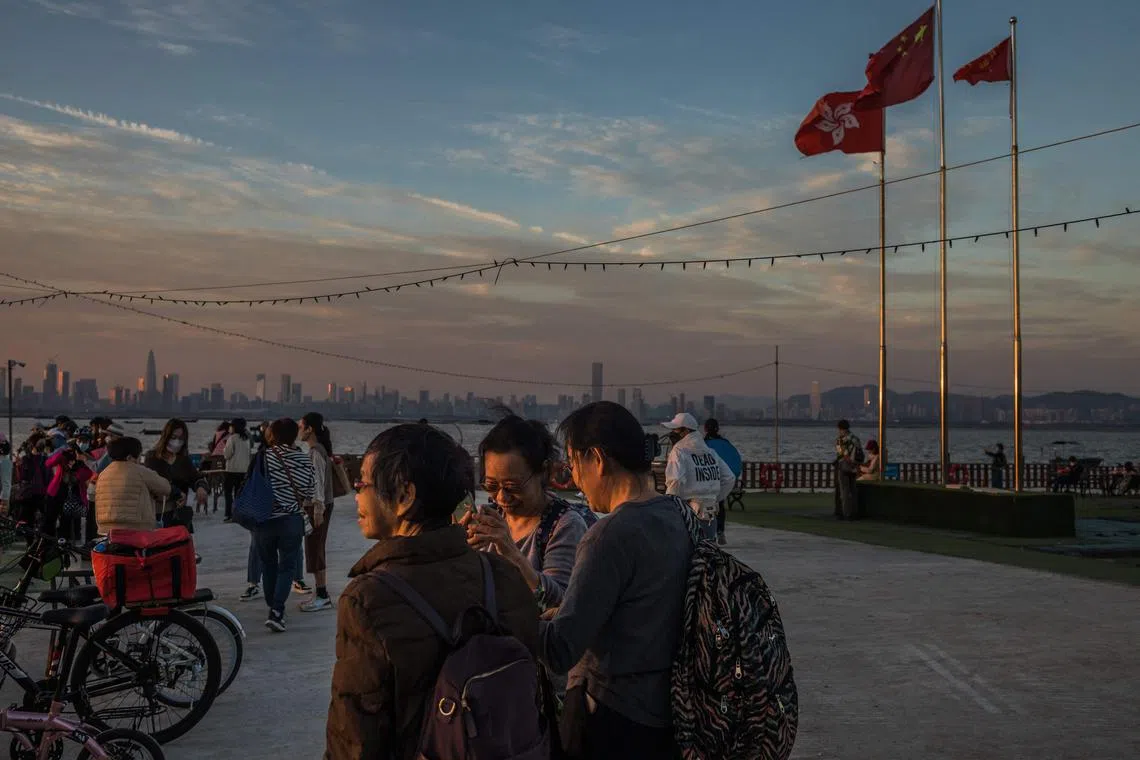 The mainland border reopening has been cautious so far. with officials implementing a 60,000-person cap per day.