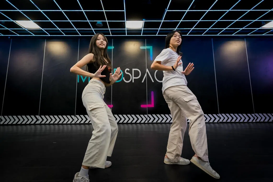Kade Wong (left) and Sim Shan Yew (right) rehearsing their dance moves at the Maddspace studio on Sept 10, 2023. Both girls are participating in a 11-day K-pop bootcamp in South Korea during the upcoming December holidays.