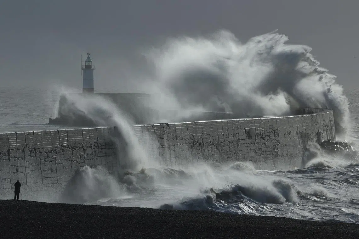 Large waves hit the seawall and harbour during Storm Isha, at Newhaven, southern Britain, on Jan 22. 