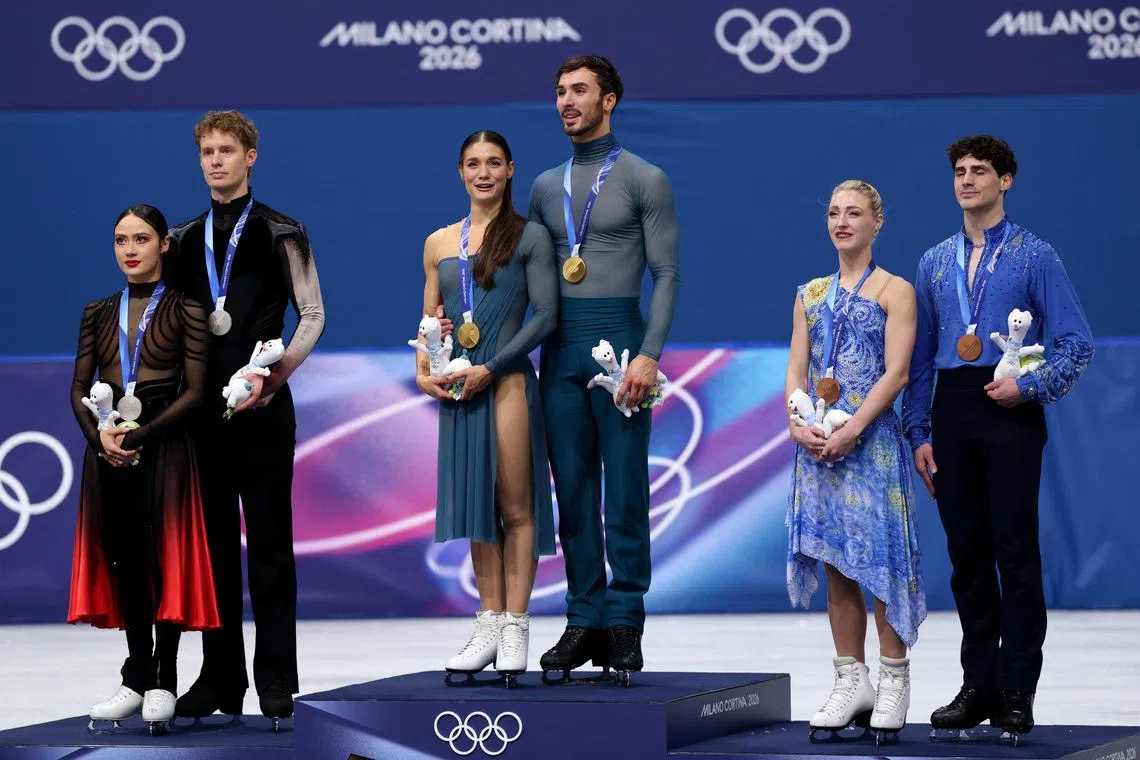 Milano Cortina 2026 Olympics - Figure Skating - Ice Dance - Victory Ceremony - Milano Ice Skating Arena, Milan, Italy - February 11, 2026. Gold medallists Laurence Fournier Beaudry of France and Guillaume Cizeron of France stand on the podium during the Ice Dance Victory Ceremony with silver medallists Madison Chock of United States and Evan Bates of United States and bronze medallists Piper Gilles of Canada and Paul Poirier of Canada REUTERS/Yara Nardi