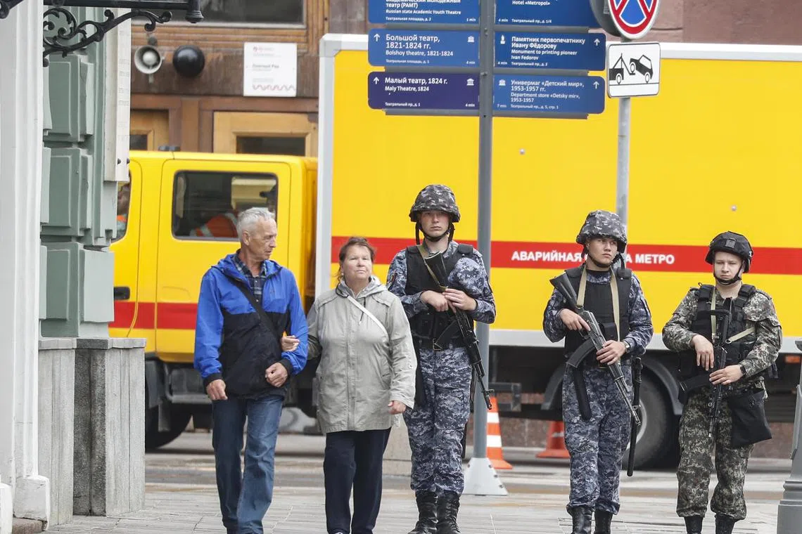 Russian servicemen stand guard on a street in downtown Moscow on June 24. 