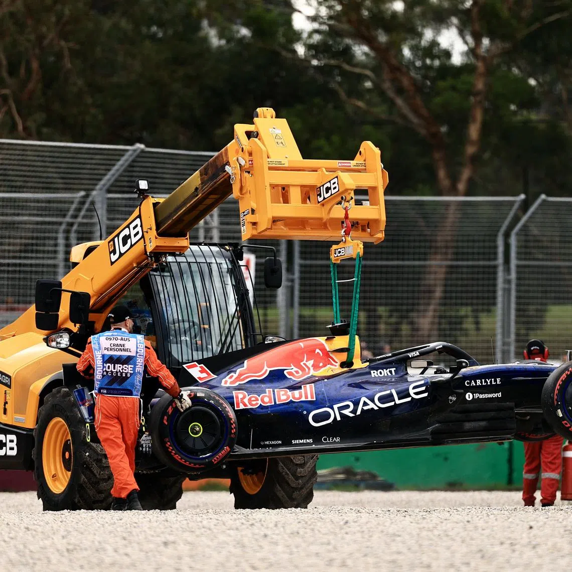 Formula One F1 - Australian Grand Prix - Albert Park Grand Prix Circuit, Melbourne, Australia - March 7, 2026 Marshals remove Red Bull's Max Verstappen car from the race track with a crane after crashing out during qualifying REUTERS/Mark Peterson