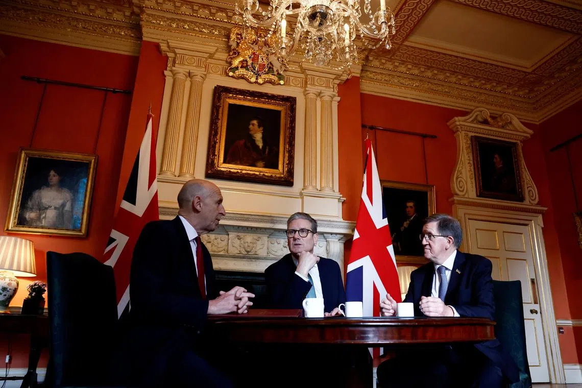 Britain's Prime Minister Keir Starmer (C) meets with Britain's Defence Secretary John Healey (L) and Member of the House of Lords George Robertson (R) at 10 Downing Street, in London, on July 16, 2024.     BENJAMIN CREMEL/Pool via REUTERS