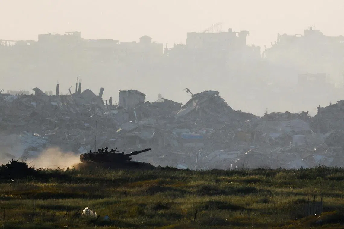A tank manoeuvring inside Gaza, as seen from Israel's border with Gaza, on March 19.    