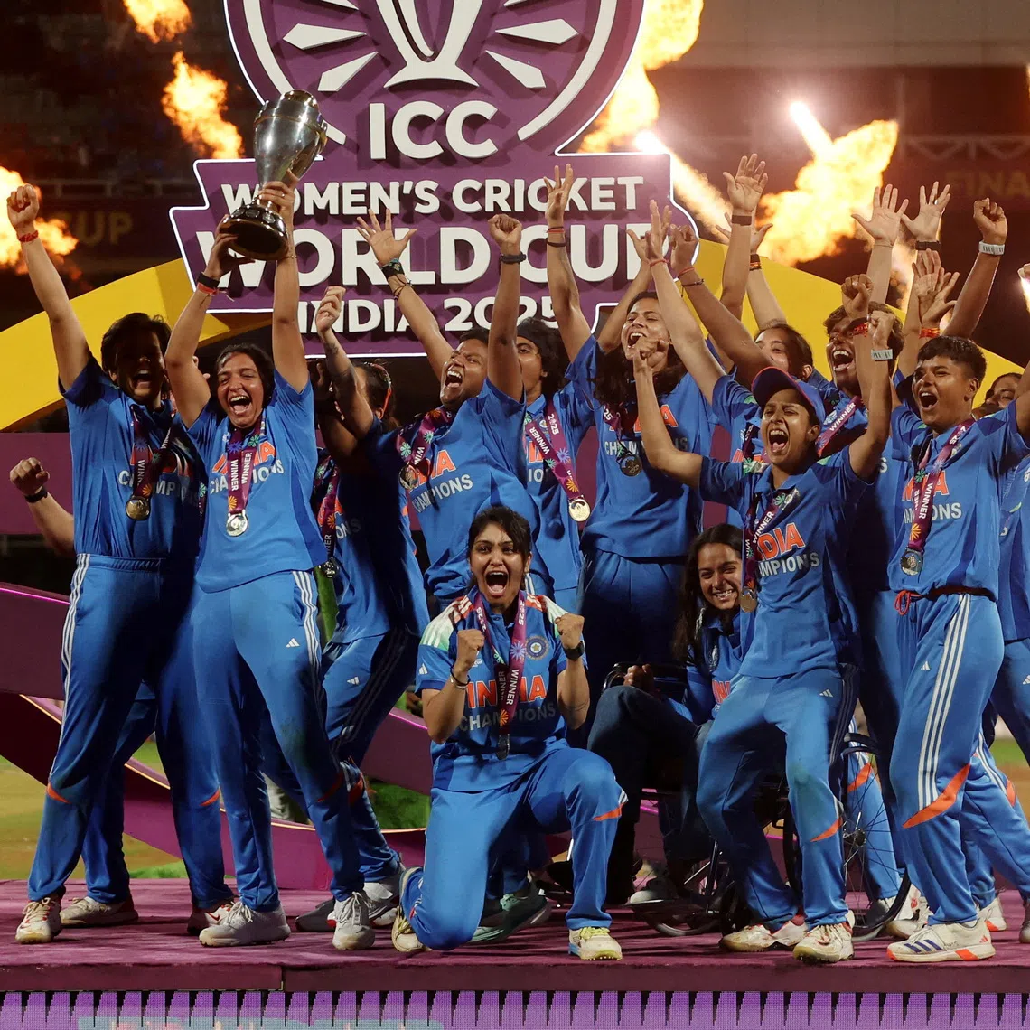 India players celebrate with the trophy after winning the ICC Women's World Cup.