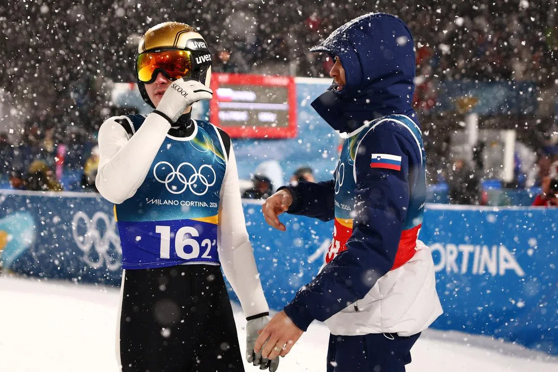 Milano Cortina 2026 Olympics - Ski Jumping - Men's Super Team - Predazzo Ski Jumping Stadium, Predazzo, Italy - February 16, 2026. Domen Prevc of Slovenia and Anze Lanisek of Slovenia during the final round REUTERS/Kacper Pempel