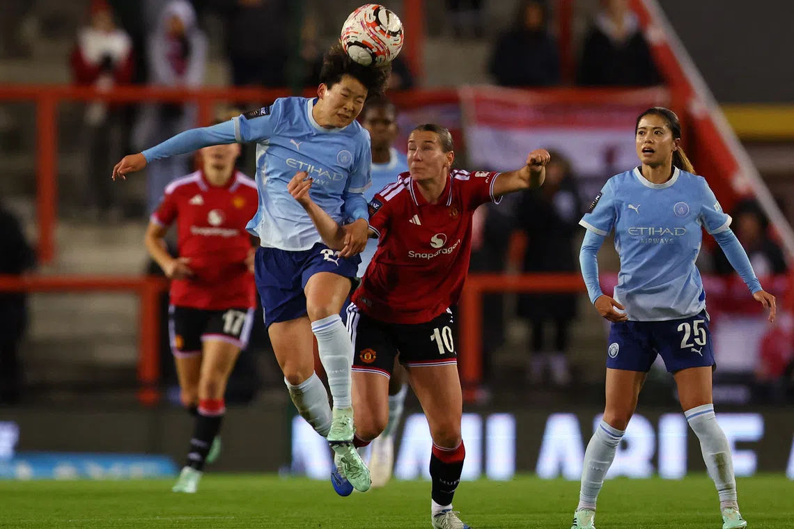 Soccer Football - Women's Super League - Manchester United v Manchester City - Leigh Sports Village, Leigh, Britain - October 25, 2026  Manchester City's Aoba Fujino in action with Manchester United's Elisabeth Terland Action Images via Reuters/Craig Brough