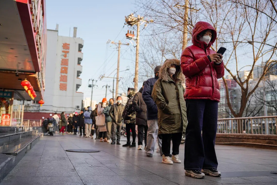 People lining up for a PCR test in Chaoyang district in Beijing, China, on 4 Dec 2022. 