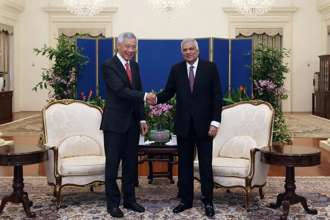 PM Lee Hsien Loong (left) and Sri Lankan President Ranil Wickremesinghe witnessed the signing of an MOU at the Istana on Aug 22.