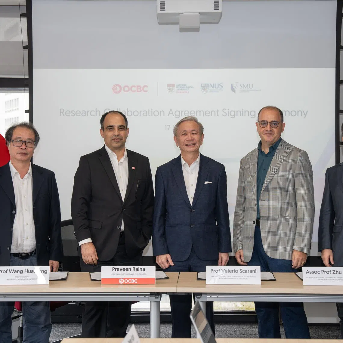The research collaborations between OCBC and the local universities were inked on July 17, and witnessed by the Ministry of Digital Development and Information's chief quantum advisor David Koh (centre).
