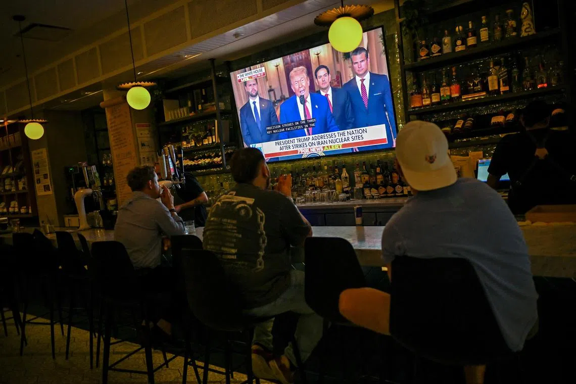Patrons of the Chapel Street Cafe in Chicago, Illinois, watch as US President Donald Trump delivers an address to the nation following US strikes on Iran's nuclear facilities, on June 21.