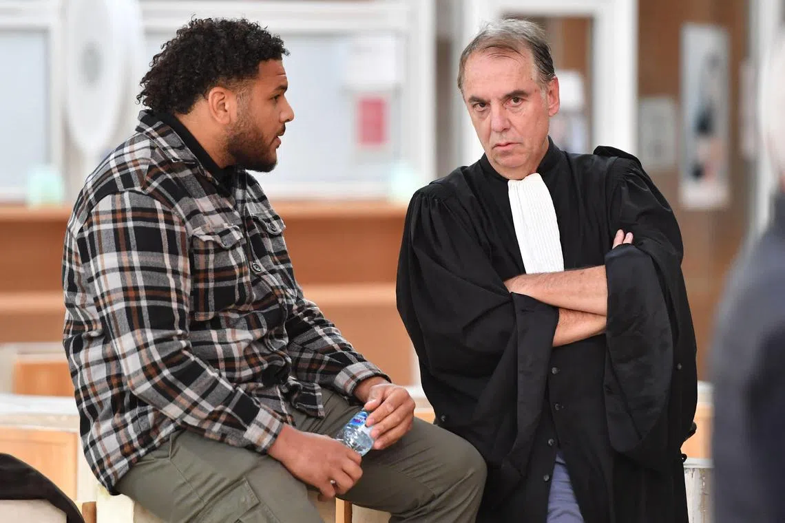 Rugby player Mohamed Haouas with his lawyer Marc Gallix at his trial in Montpellier on May 12, 2023. He received an 18-month term, half of it suspended, for aggravated assault.