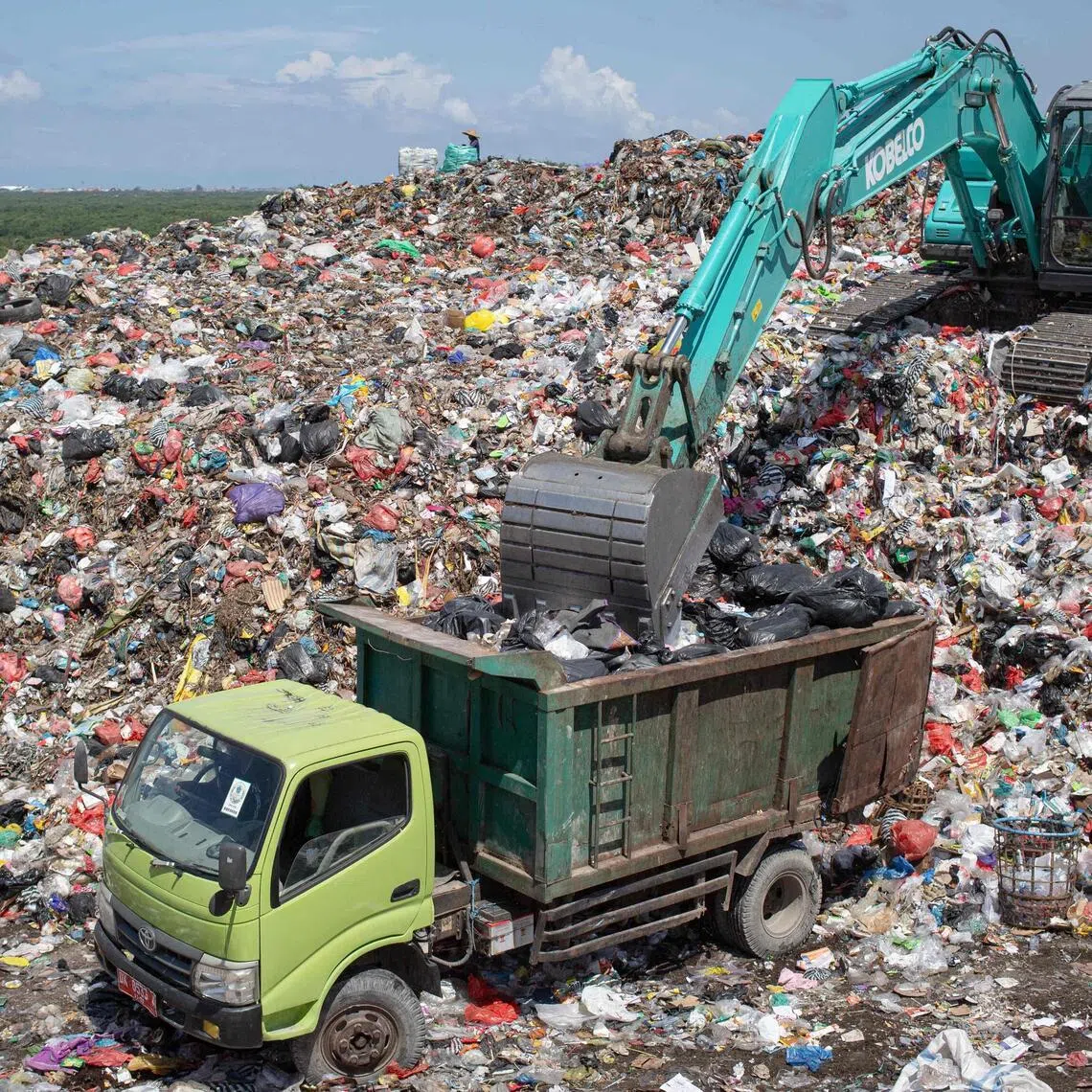 A truck arrives to unload trash at the Suwung landfill in Denpasar on April 2.